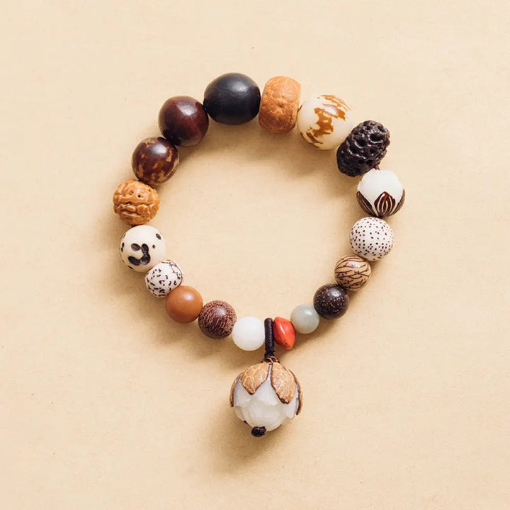Handcrafted BWOOOH Bodhi Seed Lotus Wisdom Peace Wrist Mala Bracelet, featuring 18 naturally varied bodhi seeds and a delicately engraved lotus symbol, embodying enlightenment, calm, and renewed spiritual focus.