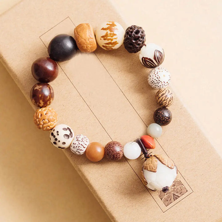 Handcrafted BWOOOH Bodhi Seed Lotus Wisdom Peace Wrist Mala Bracelet, featuring 18 naturally varied bodhi seeds and a delicately engraved lotus symbol, embodying enlightenment, calm, and renewed spiritual focus. - View 12