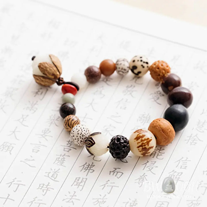 Handcrafted BWOOOH Bodhi Seed Lotus Wisdom Peace Wrist Mala Bracelet, featuring 18 naturally varied bodhi seeds and a delicately engraved lotus symbol, embodying enlightenment, calm, and renewed spiritual focus. - View 15