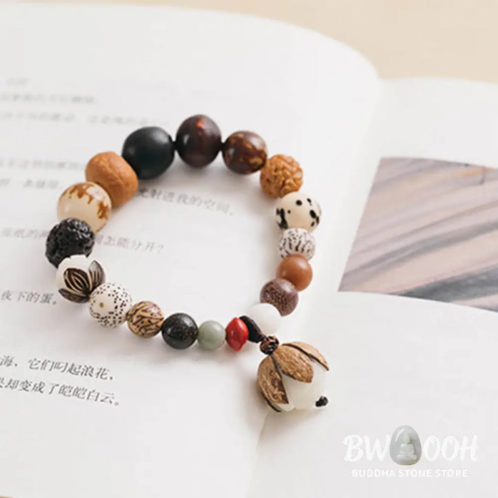 Handcrafted BWOOOH Bodhi Seed Lotus Wisdom Peace Wrist Mala Bracelet, featuring 18 naturally varied bodhi seeds and a delicately engraved lotus symbol, embodying enlightenment, calm, and renewed spiritual focus. - View 16