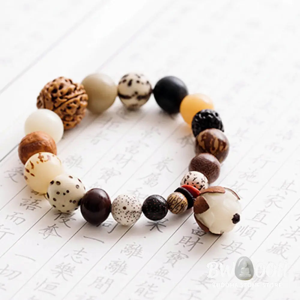 Handcrafted BWOOOH Bodhi Seed Lotus Wisdom Peace Wrist Mala Bracelet, featuring 18 naturally varied bodhi seeds and a delicately engraved lotus symbol, embodying enlightenment, calm, and renewed spiritual focus. - View 17