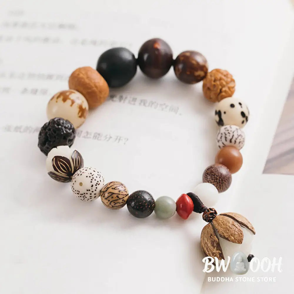 Handcrafted BWOOOH Bodhi Seed Lotus Wisdom Peace Wrist Mala Bracelet, featuring 18 naturally varied bodhi seeds and a delicately engraved lotus symbol, embodying enlightenment, calm, and renewed spiritual focus. - View 11