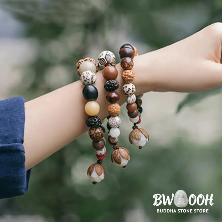Handcrafted BWOOOH Bodhi Seed Lotus Wisdom Peace Wrist Mala Bracelet, featuring 18 naturally varied bodhi seeds and a delicately engraved lotus symbol, embodying enlightenment, calm, and renewed spiritual focus. - View 2