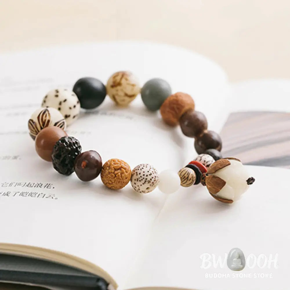 Handcrafted BWOOOH Bodhi Seed Lotus Wisdom Peace Wrist Mala Bracelet, featuring 18 naturally varied bodhi seeds and a delicately engraved lotus symbol, embodying enlightenment, calm, and renewed spiritual focus. - View 9
