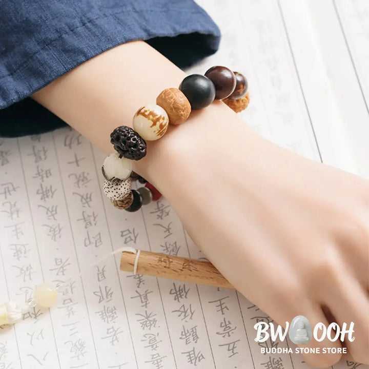 Handcrafted BWOOOH Bodhi Seed Lotus Wisdom Peace Wrist Mala Bracelet, featuring 18 naturally varied bodhi seeds and a delicately engraved lotus symbol, embodying enlightenment, calm, and renewed spiritual focus. - View 5