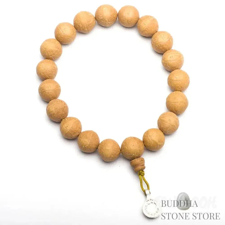 Close-up of BWOOOH Bodhi Seed Wrist Mala featuring dark-speckled 13mm/15mm bodhi seeds on premium elastic string, with a delicate tassel, worn as a meditation accessory or carried as a pocket mala. Unisex. - View 5