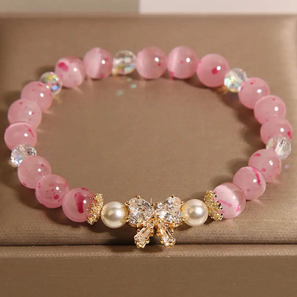 BWOOOH Cherry Blossom Pink Cat's Eye Pearl Bow-knot Rosette Support Bracelet — Pearl crystal healing bracelet for spiritua...