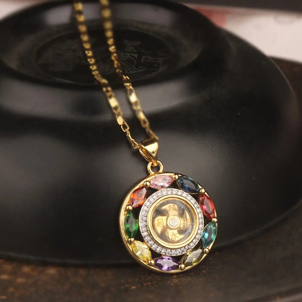 BWOOOH Colorful Zircon Copper Wealth Luck Rotation Bracelet Necklace Pendant, showcasing a luminous zircon centerpiece encircled by copper, adjustable red string, ready for spiritual balance and positive energy.
