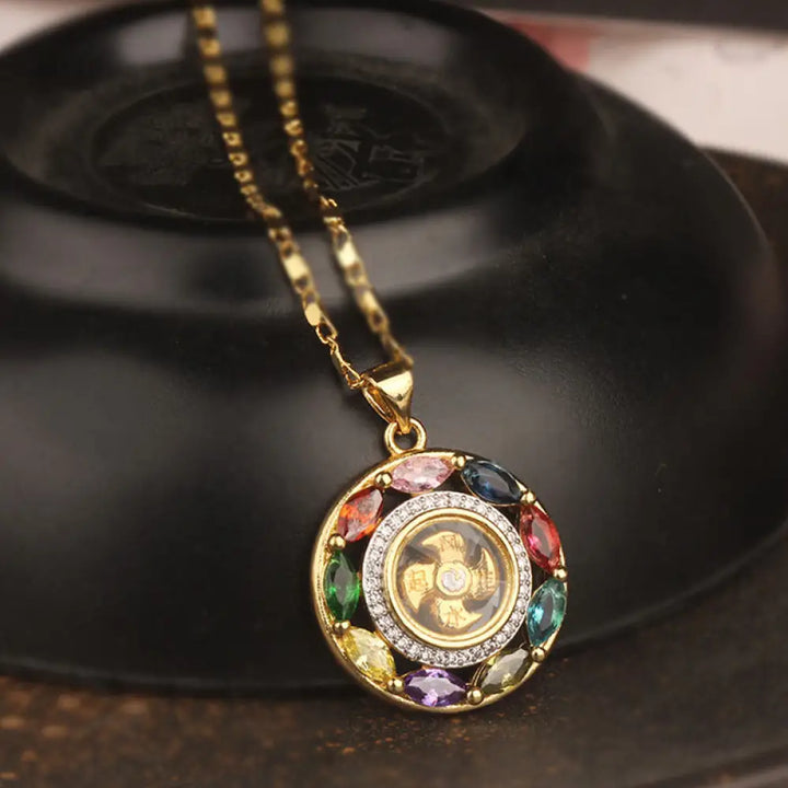 BWOOOH Colorful Zircon Copper Wealth Luck Rotation Bracelet Necklace Pendant, showcasing a luminous zircon centerpiece encircled by copper, adjustable red string, ready for spiritual balance and positive energy.