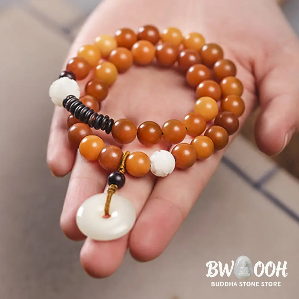 BWOOOH Cyan Bodhi Seed Lotus Jade Peace Buckle Wisdom Double Wrap Bracelet, featuring 10mm vibrant cyan bodhi seeds, serene jade, and intricate small leaf red sandalwood beads. Symbolizes enlightenment, inner peace, and spiritual balance for mindful practice and daily wear. - View 17