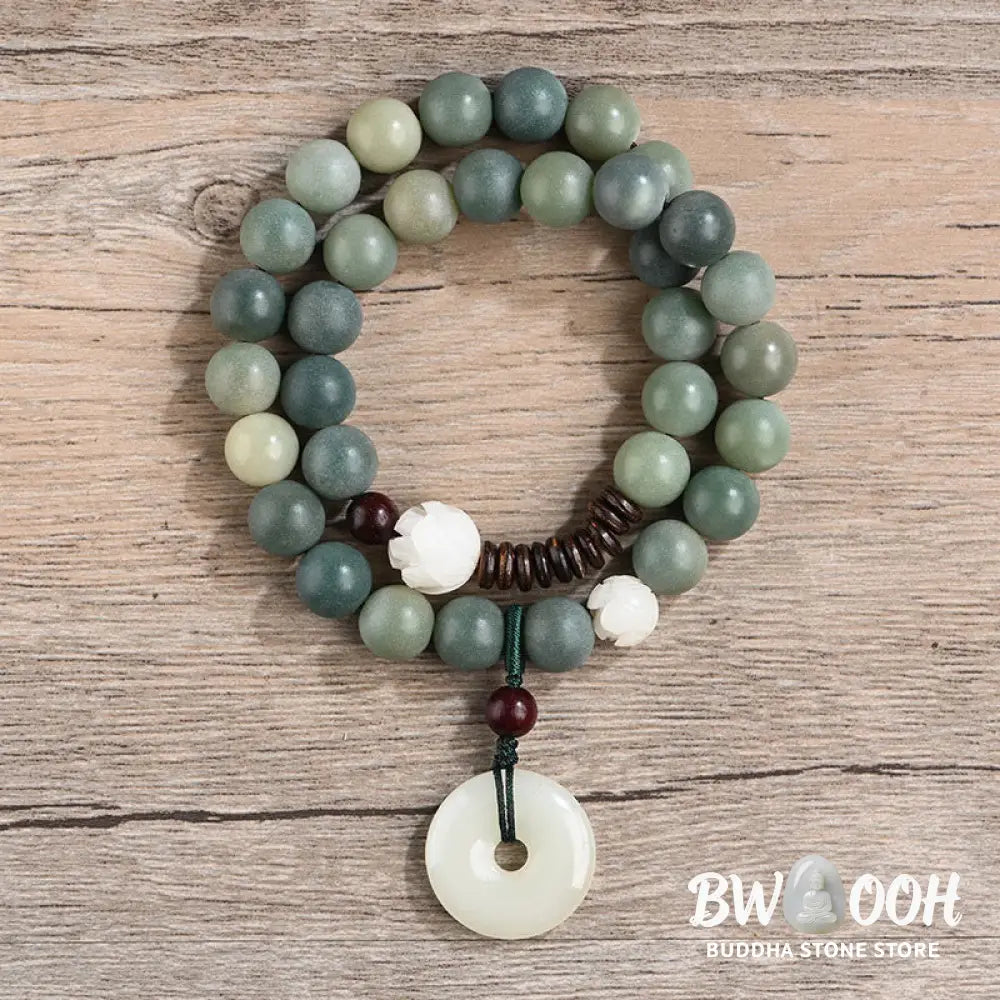 BWOOOH Cyan Bodhi Seed Lotus Jade Peace Buckle Wisdom Double Wrap Bracelet, featuring 10mm vibrant cyan bodhi seeds, serene jade, and intricate small leaf red sandalwood beads. Symbolizes enlightenment, inner peace, and spiritual balance for mindful practice and daily wear. - View 2