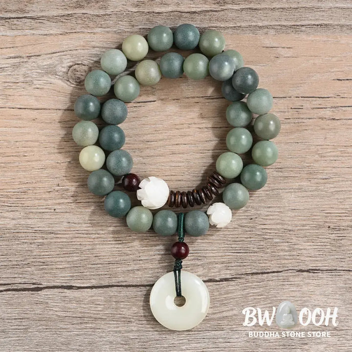 BWOOOH Cyan Bodhi Seed Lotus Jade Peace Buckle Wisdom Double Wrap Bracelet, featuring 10mm vibrant cyan bodhi seeds, serene jade, and intricate small leaf red sandalwood beads. Symbolizes enlightenment, inner peace, and spiritual balance for mindful practice and daily wear. - View 2