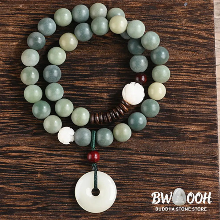 BWOOOH Cyan Bodhi Seed Lotus Jade Peace Buckle Wisdom Double Wrap Bracelet, featuring 10mm vibrant cyan bodhi seeds, serene jade, and intricate small leaf red sandalwood beads. Symbolizes enlightenment, inner peace, and spiritual balance for mindful practice and daily wear. - View 14