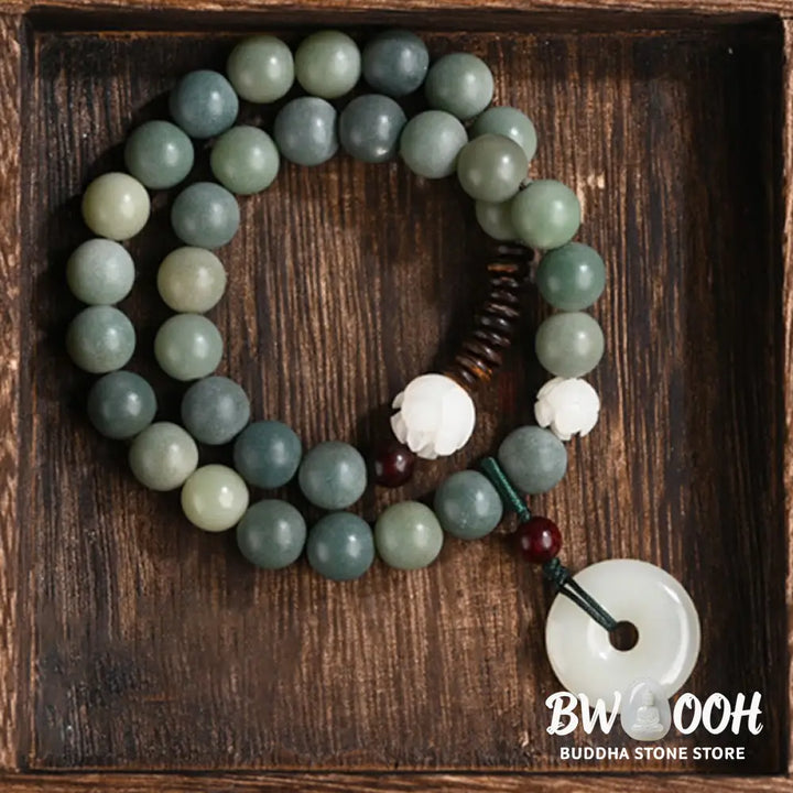 BWOOOH Cyan Bodhi Seed Lotus Jade Peace Buckle Wisdom Double Wrap Bracelet, featuring 10mm vibrant cyan bodhi seeds, serene jade, and intricate small leaf red sandalwood beads. Symbolizes enlightenment, inner peace, and spiritual balance for mindful practice and daily wear. - View 9