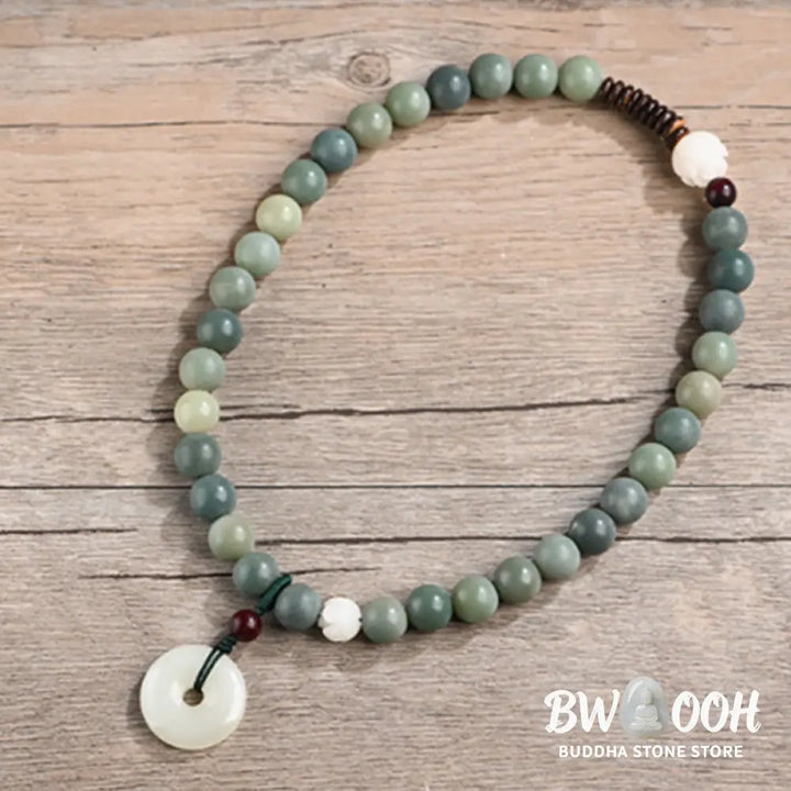 BWOOOH Cyan Bodhi Seed Lotus Jade Peace Buckle Wisdom Double Wrap Bracelet, featuring 10mm vibrant cyan bodhi seeds, serene jade, and intricate small leaf red sandalwood beads. Symbolizes enlightenment, inner peace, and spiritual balance for mindful practice and daily wear. - View 13