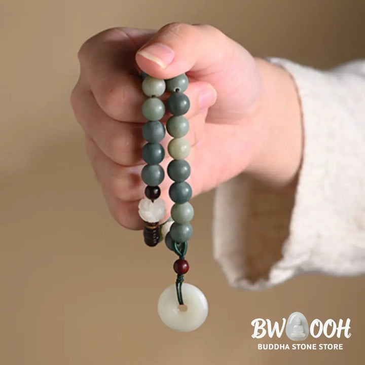 BWOOOH Cyan Bodhi Seed Lotus Jade Peace Buckle Wisdom Double Wrap Bracelet, featuring 10mm vibrant cyan bodhi seeds, serene jade, and intricate small leaf red sandalwood beads. Symbolizes enlightenment, inner peace, and spiritual balance for mindful practice and daily wear. - View 12