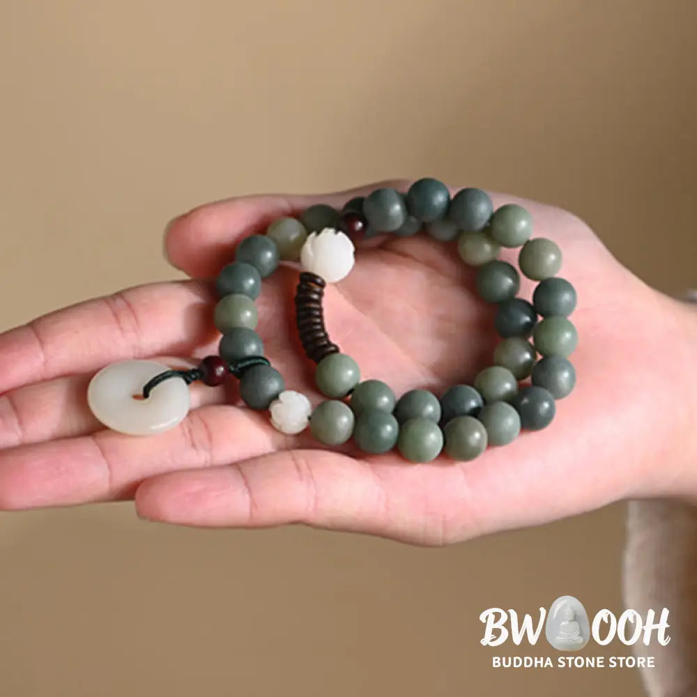 BWOOOH Cyan Bodhi Seed Lotus Jade Peace Buckle Wisdom Double Wrap Bracelet, featuring 10mm vibrant cyan bodhi seeds, serene jade, and intricate small leaf red sandalwood beads. Symbolizes enlightenment, inner peace, and spiritual balance for mindful practice and daily wear. - View 11