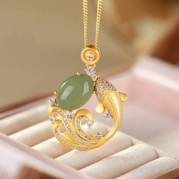 BWOOOH Cyan Jade Koi Fish Healing Calm Necklace Pendant. Intricately carved serene blue-green jade koi, symbolizing prosperity, success, and inner harmony. Adjustable length.
