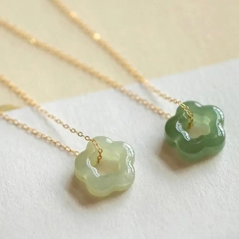 BWOOOH Dainty Hetian Cyan Jade Luck Floral Charm Necklace Pendant with 925 Sterling Silver chain, showcasing a delicate jade floral design for prosperity and spiritual balance.