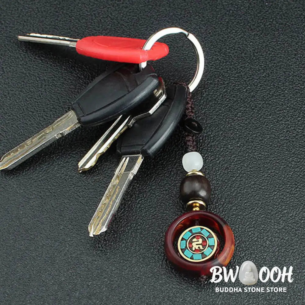 Buddha Stones Ebony Wood Sanskrit Four-leaf Clover Buddha’s Eye Peace Rotatable Key Chain - Key Chain
