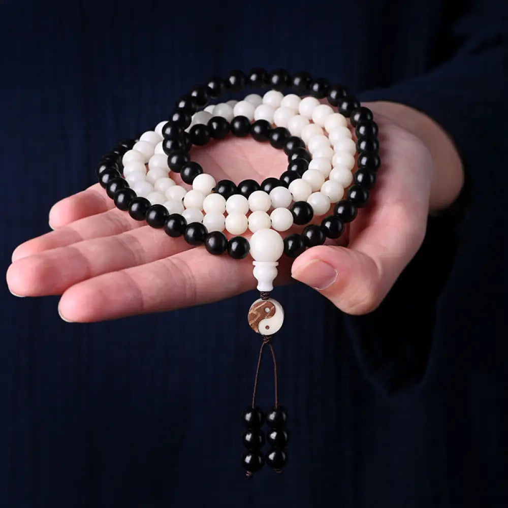 BWOOOH Ebony YinYang Protection Necklace Mala featuring 8mm Ebony and Bodhi Seed beads, designed for spiritual balance, protection, and focused meditation.