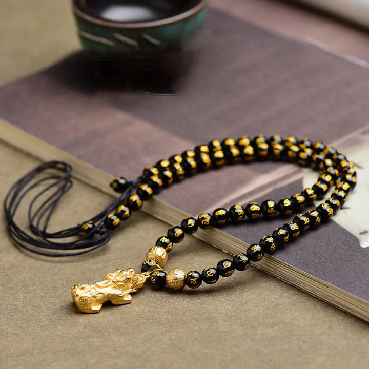 BWOOOH FengShui Black Obsidian PiXiu Wealth Necklace — carved PiXiu pendant on adjustable rope for protection and prosperity