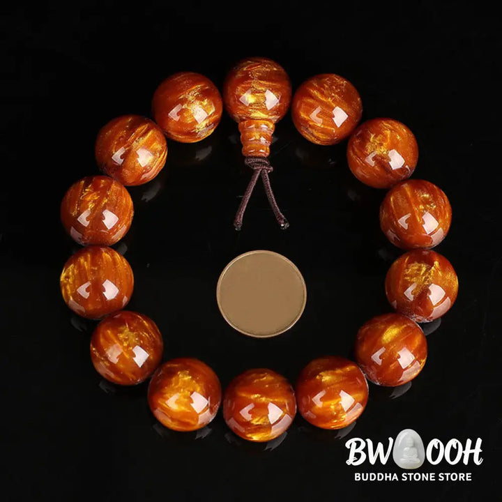 BWOOOH Golden Sea Willow Success Positive Bracelet Mala, handcrafted from synthetic Golden Sea Willow. Features rich golden hues, polished beads (various sizes like 15mm, 18mm, 108-bead configurations), and an elastic string, worn for mindfulness, prosperity, and spiritual balance. - View 3