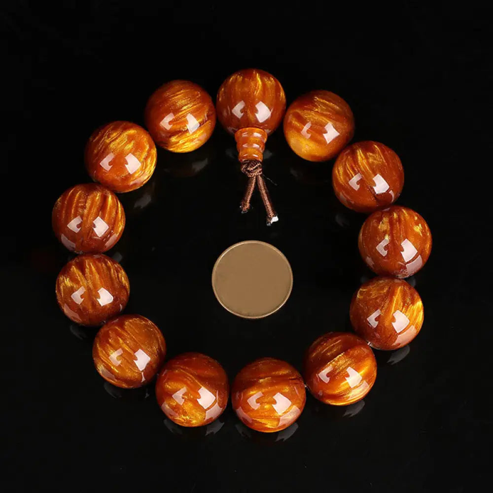 BWOOOH Golden Sea Willow Success Positive Bracelet Mala, handcrafted from synthetic Golden Sea Willow. Features rich golden hues, polished beads (various sizes like 15mm, 18mm, 108-bead configurations), and an elastic string, worn for mindfulness, prosperity, and spiritual balance. - View 10