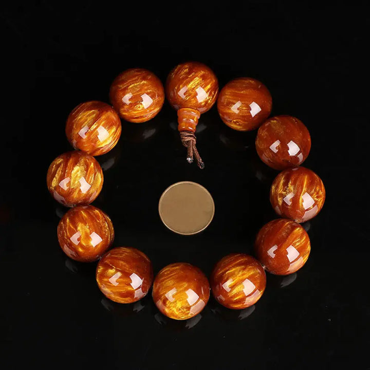 BWOOOH Golden Sea Willow Success Positive Bracelet Mala, handcrafted from synthetic Golden Sea Willow. Features rich golden hues, polished beads (various sizes like 15mm, 18mm, 108-bead configurations), and an elastic string, worn for mindfulness, prosperity, and spiritual balance. - View 11