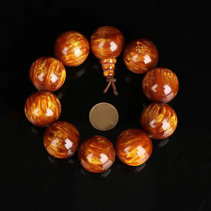 BWOOOH Golden Sea Willow Success Positive Bracelet Mala, handcrafted from synthetic Golden Sea Willow. Features rich golden hues, polished beads (various sizes like 15mm, 18mm, 108-bead configurations), and an elastic string, worn for mindfulness, prosperity, and spiritual balance. - View 12