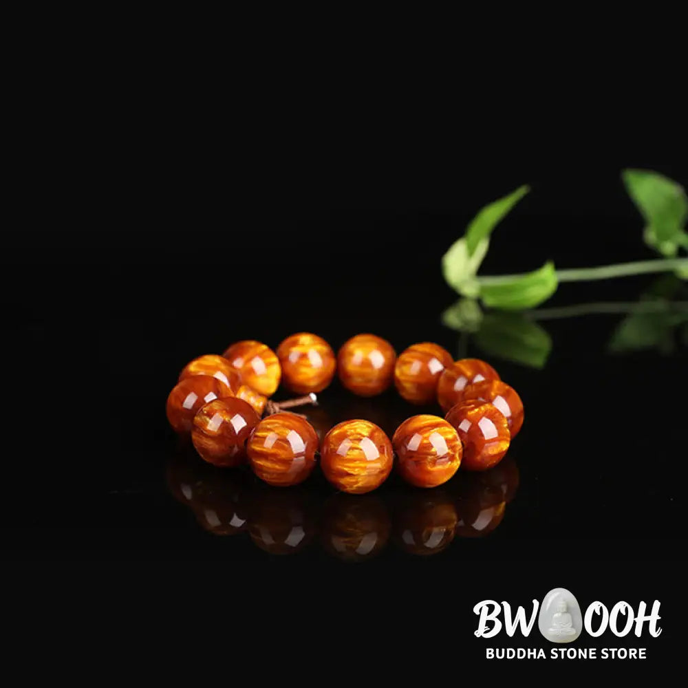 BWOOOH Golden Sea Willow Success Positive Bracelet Mala, handcrafted from synthetic Golden Sea Willow. Features rich golden hues, polished beads (various sizes like 15mm, 18mm, 108-bead configurations), and an elastic string, worn for mindfulness, prosperity, and spiritual balance. - View 5