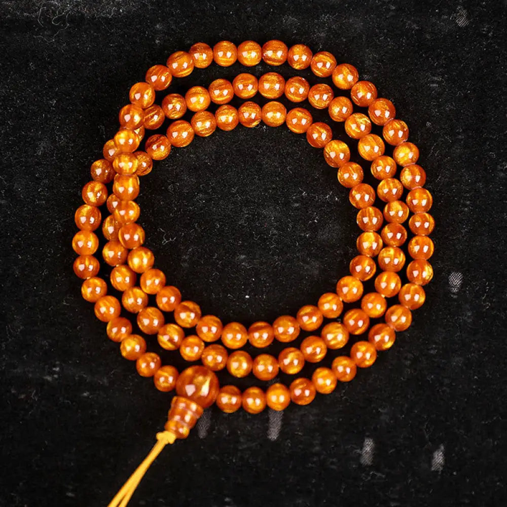 BWOOOH Golden Sea Willow Success Positive Bracelet Mala, handcrafted from synthetic Golden Sea Willow. Features rich golden hues, polished beads (various sizes like 15mm, 18mm, 108-bead configurations), and an elastic string, worn for mindfulness, prosperity, and spiritual balance. - View 14