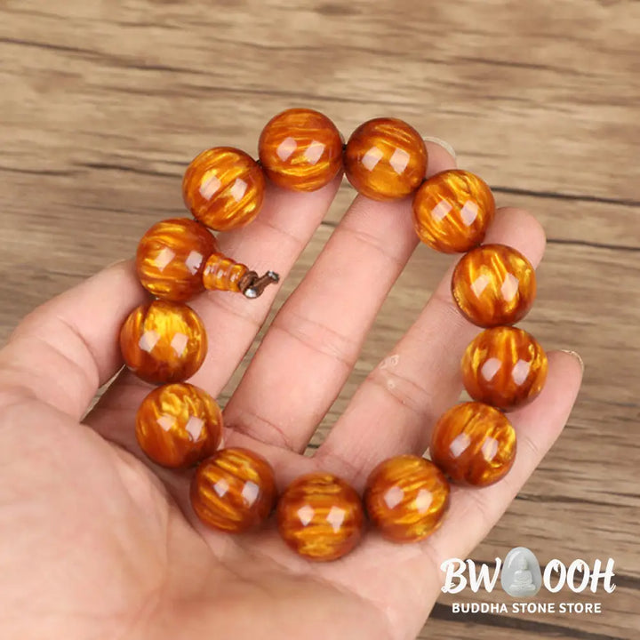 BWOOOH Golden Sea Willow Success Positive Bracelet Mala, handcrafted from synthetic Golden Sea Willow. Features rich golden hues, polished beads (various sizes like 15mm, 18mm, 108-bead configurations), and an elastic string, worn for mindfulness, prosperity, and spiritual balance. - View 4