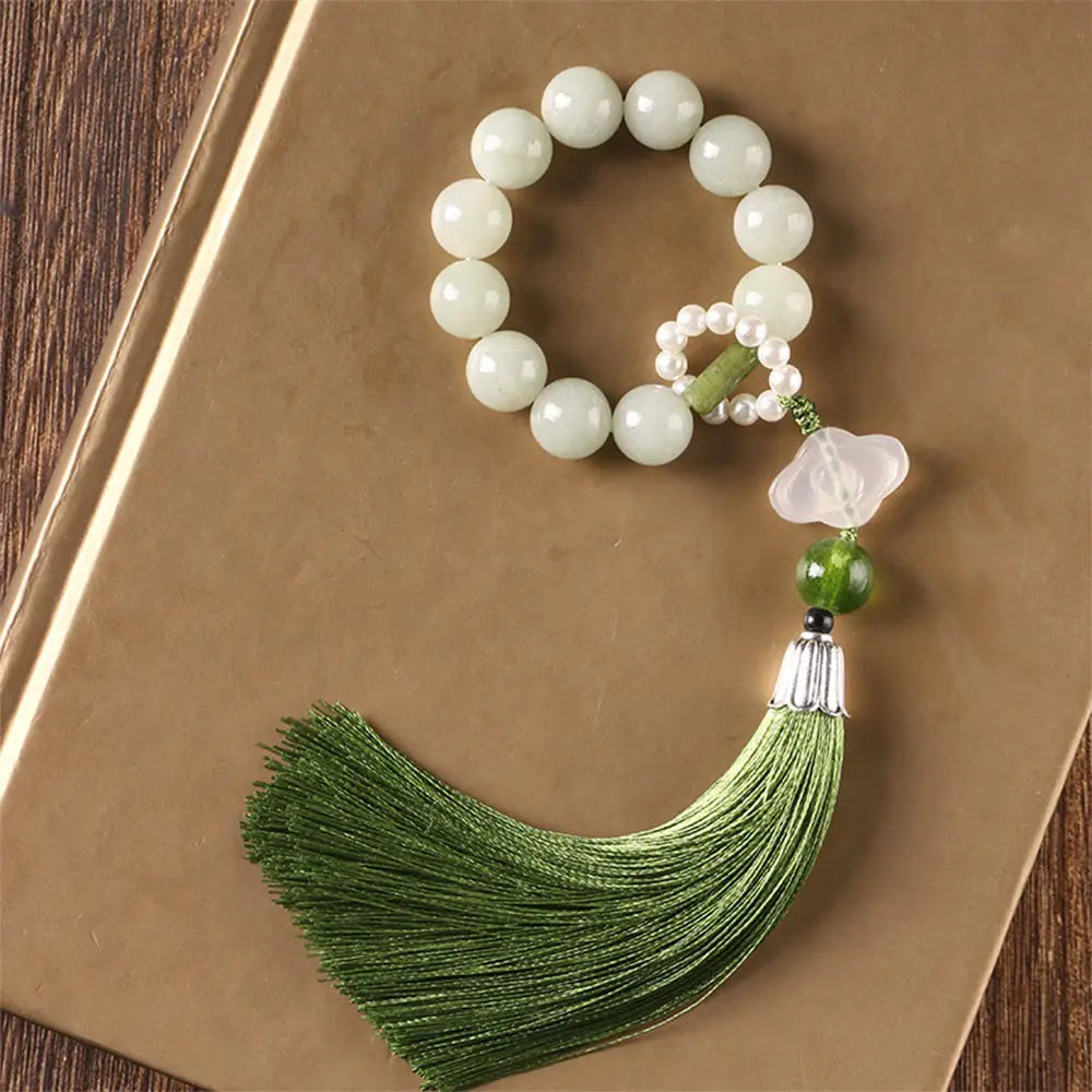 BWOOOH Green Jade & Pearl Wrist Mala. Polished 10mm jade beads, luminous pearls, prosperity tassel. Handcrafted for spiritual calm, abundance, and focus in mindfulness practice.
