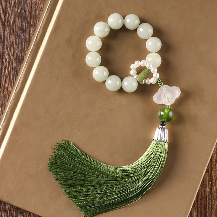 BWOOOH Green Jade &amp; Pearl Wrist Mala. Polished 10mm jade beads, luminous pearls, prosperity tassel. Handcrafted for spiritual calm, abundance, and focus in mindfulness practice.