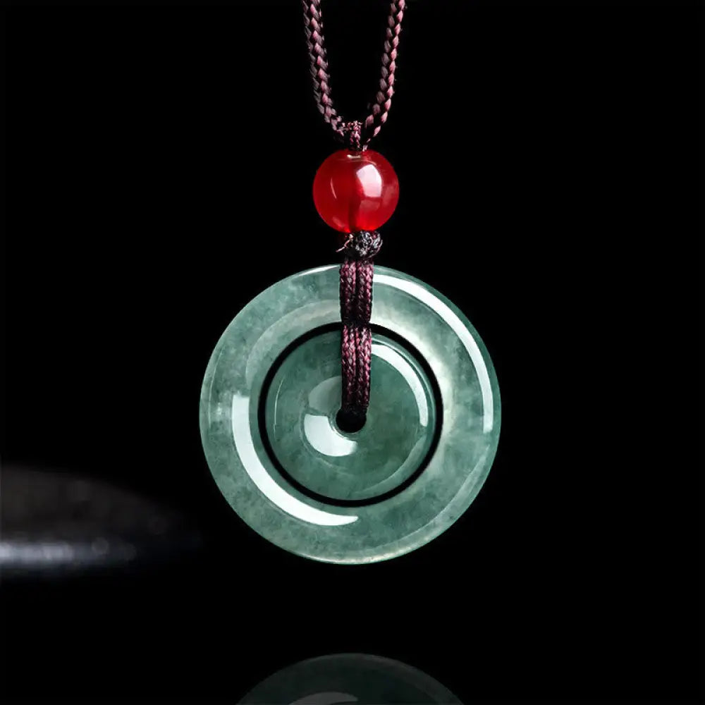 BWOOOH handcrafted Green Jade Double Peace Buckle abundance necklace pendant, featuring two polished circular jade discs with a rope chain, symbolizing harmony, prosperity, and inner peace.