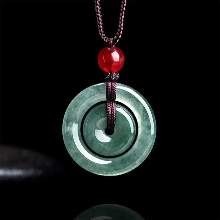 BWOOOH handcrafted Green Jade Double Peace Buckle abundance necklace pendant, featuring two polished circular jade discs with a rope chain, symbolizing harmony, prosperity, and inner peace.