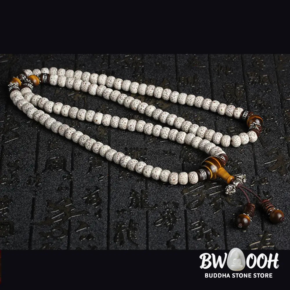 A close-up of a BWOOOH Handmade Tibetan Tiger Eye Bodhi Seed Peace Bracelet, featuring 108 natural variegated Bodhi seeds alternating with golden-brown Tiger Eye beads, symbolizing spiritual protection and inner peace for mindful wearers. - View 4