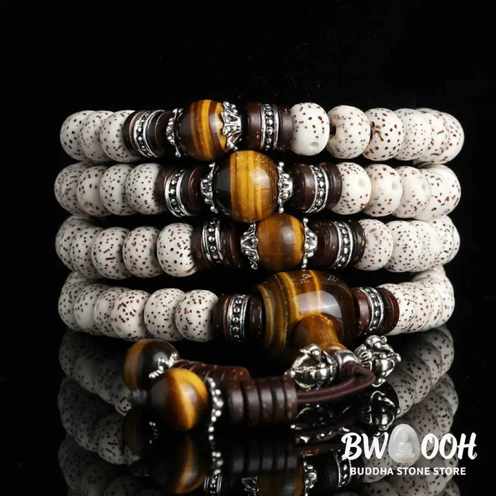 A close-up of a BWOOOH Handmade Tibetan Tiger Eye Bodhi Seed Peace Bracelet, featuring 108 natural variegated Bodhi seeds alternating with golden-brown Tiger Eye beads, symbolizing spiritual protection and inner peace for mindful wearers. - View 3