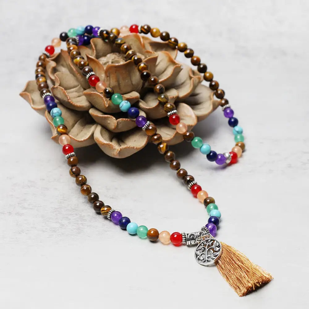 A BWOOOH 108-bead mala featuring 6mm polished Amethyst, lustrous Tiger Eye, and grounding Volcanic stones, styled as a multilayer bracelet and necklace for meditation and 7 Chakra healing. - View 9