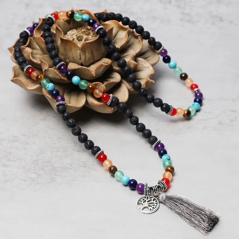 A BWOOOH 108-bead mala featuring 6mm polished Amethyst, lustrous Tiger Eye, and grounding Volcanic stones, styled as a multilayer bracelet and necklace for meditation and 7 Chakra healing. - View 13