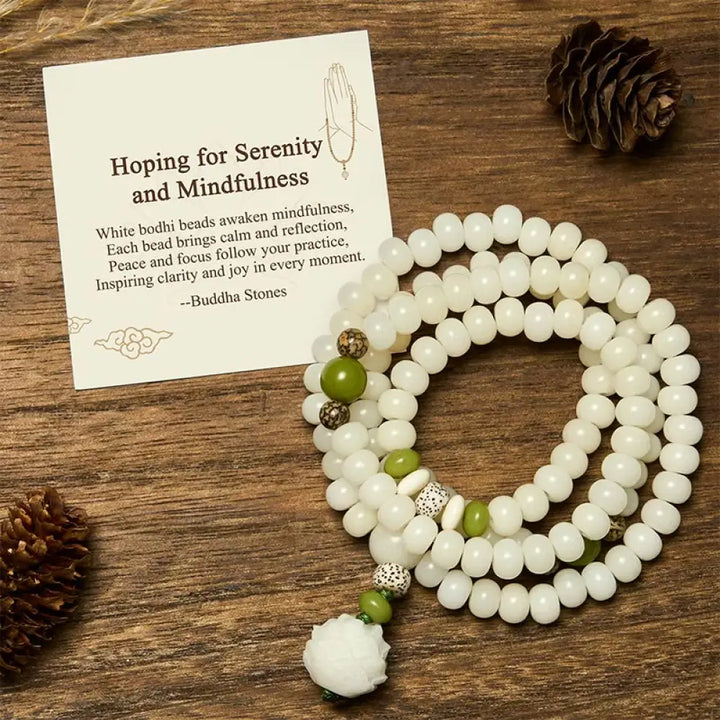 BWOOOH Bodhi Lotus Mala necklace, handcrafted with 108 natural Bodhi seeds (mix of 6x8mm and 8x10mm) and a central, delicate Lotus flower pendant. This spiritual meditation tool, designed for serenity and mindfulness, is artfully displayed with its accompanying gift message card. Promotes enlightenment, peace, and resilience.