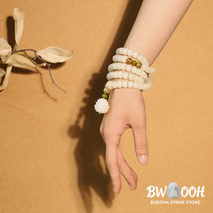 BWOOOH Bodhi Lotus Mala necklace, handcrafted with 108 natural Bodhi seeds (mix of 6x8mm and 8x10mm) and a central, delicate Lotus flower pendant. This spiritual meditation tool, designed for serenity and mindfulness, is artfully displayed with its accompanying gift message card. Promotes enlightenment, peace, and resilience. - View 17