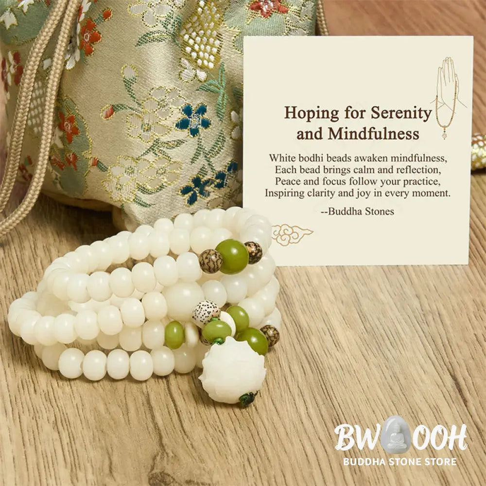 BWOOOH Bodhi Lotus Mala necklace, handcrafted with 108 natural Bodhi seeds (mix of 6x8mm and 8x10mm) and a central, delicate Lotus flower pendant. This spiritual meditation tool, designed for serenity and mindfulness, is artfully displayed with its accompanying gift message card. Promotes enlightenment, peace, and resilience. - View 8
