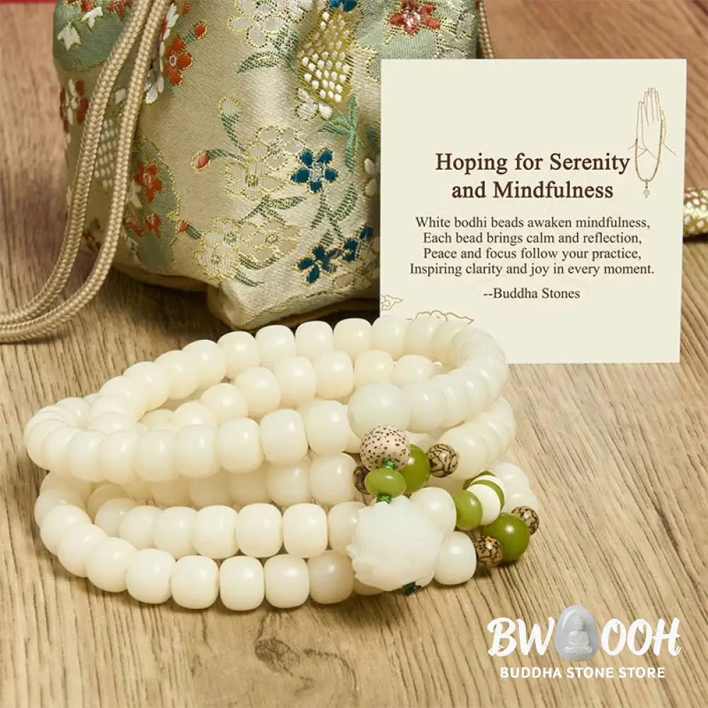 BWOOOH Bodhi Lotus Mala necklace, handcrafted with 108 natural Bodhi seeds (mix of 6x8mm and 8x10mm) and a central, delicate Lotus flower pendant. This spiritual meditation tool, designed for serenity and mindfulness, is artfully displayed with its accompanying gift message card. Promotes enlightenment, peace, and resilience. - View 11