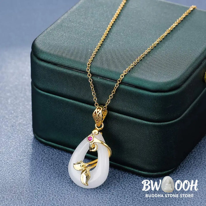 BWOOOH handmade Oval Jade Blessing Fortune Necklace Pendant, featuring a smooth, polished green jade oval on a shimmering titanium steel chain. Symbolizes prosperity, mental clarity, and improved sleep. - View 5