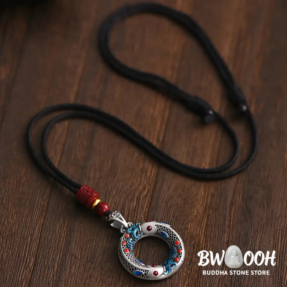 BWOOOH handcrafted copper-plated gold Koi Fish Peace Buckle necklace pendant with rope and cinnabar accents, symbolizing wealth, luck, and spiritual tranquility. A detailed 4.1x2.9cm amulet for prosperity. - View 6