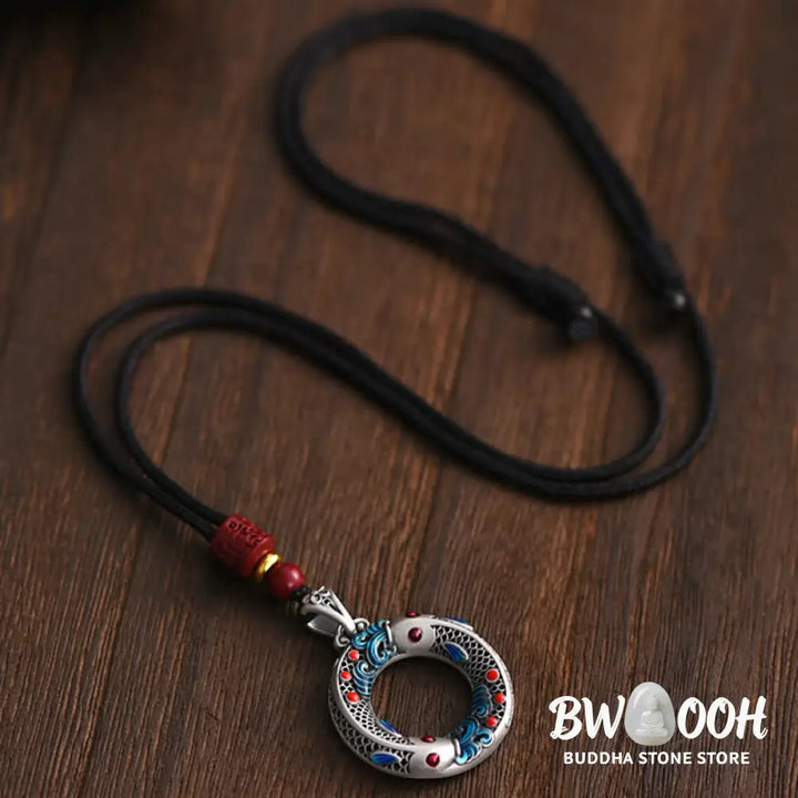 BWOOOH handcrafted copper-plated gold Koi Fish Peace Buckle necklace pendant with rope and cinnabar accents, symbolizing wealth, luck, and spiritual tranquility. A detailed 4.1x2.9cm amulet for prosperity. - View 6