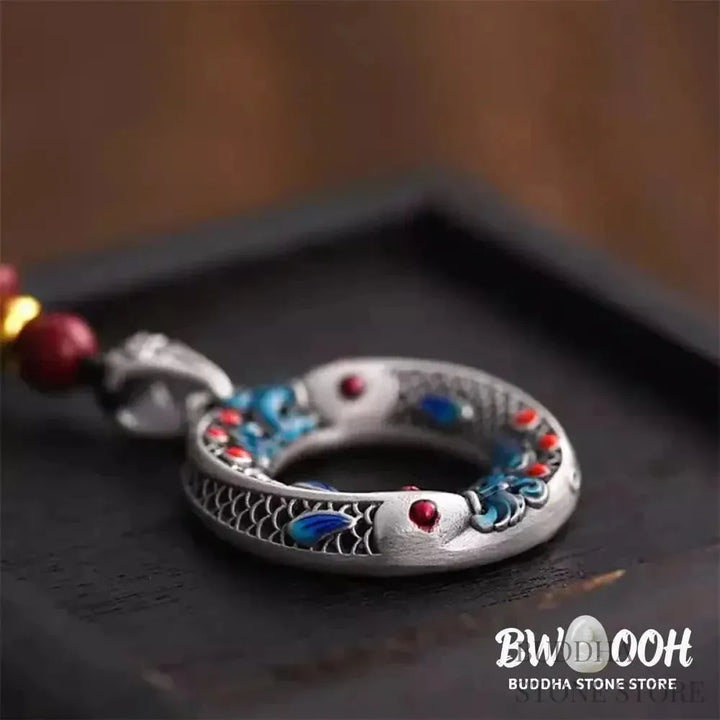 BWOOOH handcrafted copper-plated gold Koi Fish Peace Buckle necklace pendant with rope and cinnabar accents, symbolizing wealth, luck, and spiritual tranquility. A detailed 4.1x2.9cm amulet for prosperity. - View 4