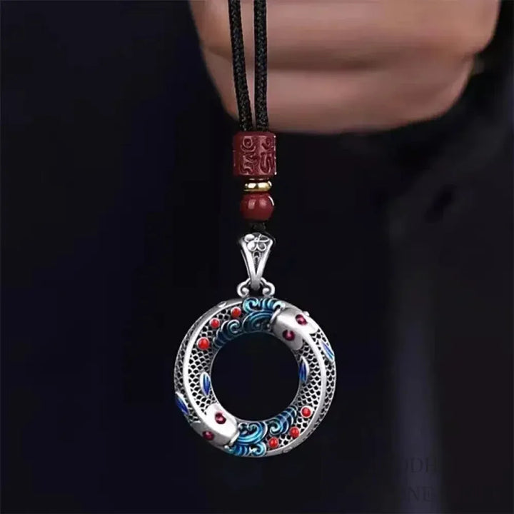 BWOOOH handcrafted copper-plated gold Koi Fish Peace Buckle necklace pendant with rope and cinnabar accents, symbolizing wealth, luck, and spiritual tranquility. A detailed 4.1x2.9cm amulet for prosperity.